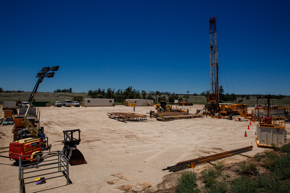 A panoramic view of a well servicing rig landscape showcasing various equipment and machinery used in the oil and gas industry
